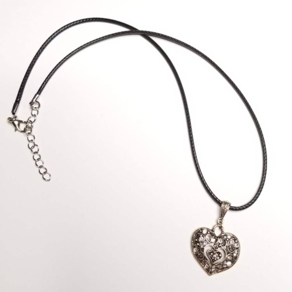 Silver-plated rhinestone Western heart pendant on black chord necklace